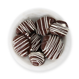 Fresa enchilada cubierta de tres chocolates